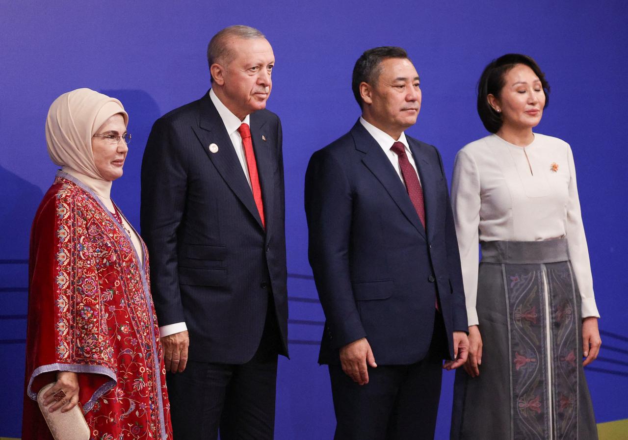 In this pool photograph distributed by the Russian state agency Sputnik, Türkiye's President Recep Tayyip Erdogan and his wife Emine Erdogan pose with Kyrgyzstan's President Sadyr Japarov and first lady Aigul prior to the opening ceremony of the 6th World Nomad Games at the Bishkek Arena in Bishkek on August 31, 2026. (Photo by Sputnik / AFP)