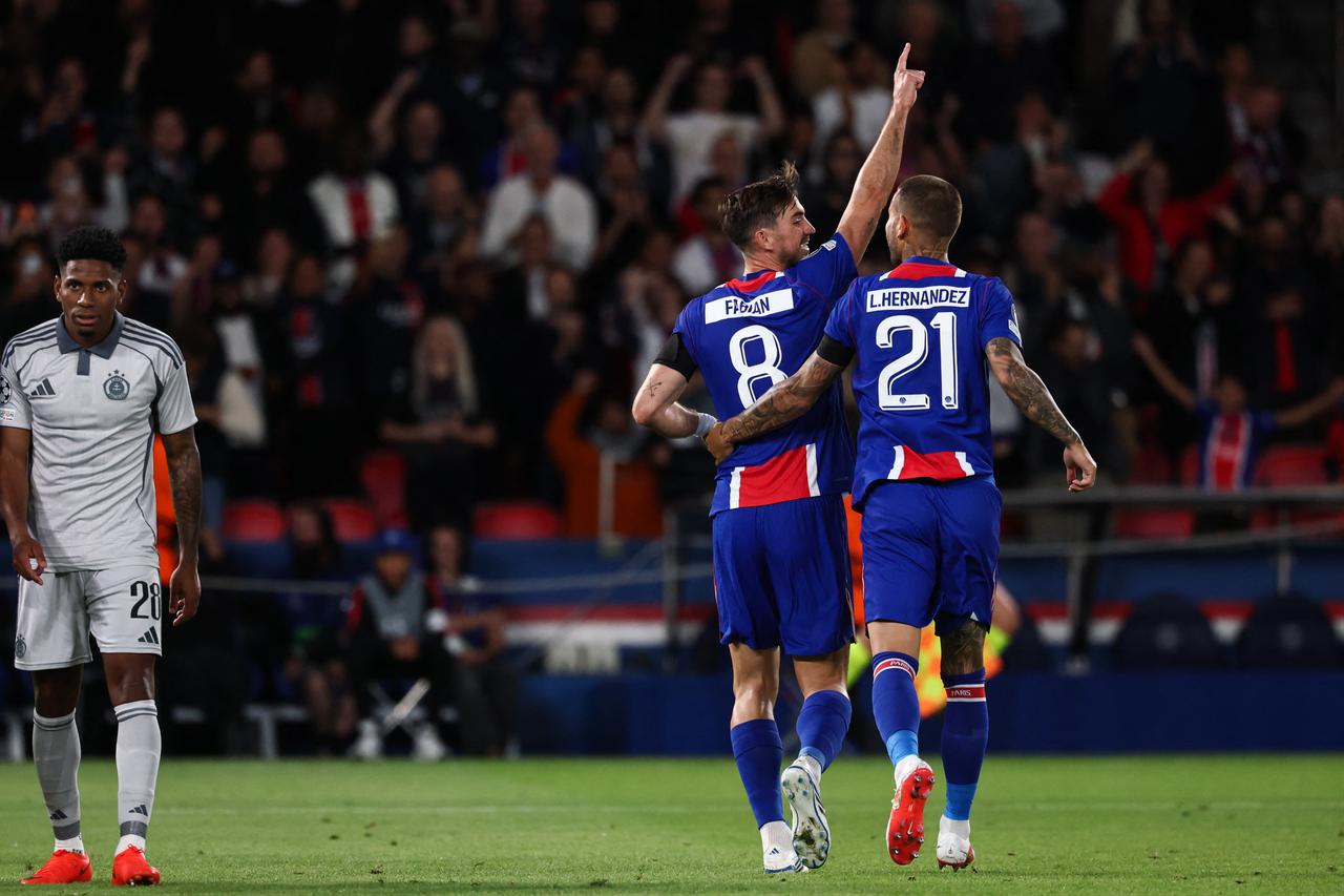 Paris Saint-Germain's Spanish midfielder #08 Fabian Ruiz (L) celebrates with Paris Saint-Germain's French defender #21 Lucas Hernandez (R) after scoring his team sixth goal during the UEFA Champions League, league phase, matchday 1, football match between Paris Saint-Germain (PSG) and Slovan Bratislava at the Parc des Princes Stadium in Paris on September 9, 2026. (AFP Photo)