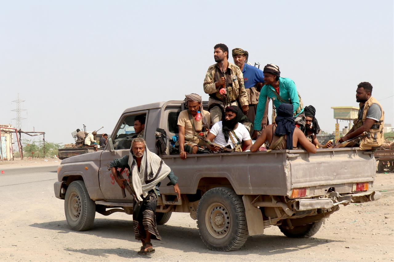 Forces loyal to Yemen's Saudi-backed government ride in a pickup truck in the Hays district, south of Hodeidah, on September 5, 2026. (AFP Photo)