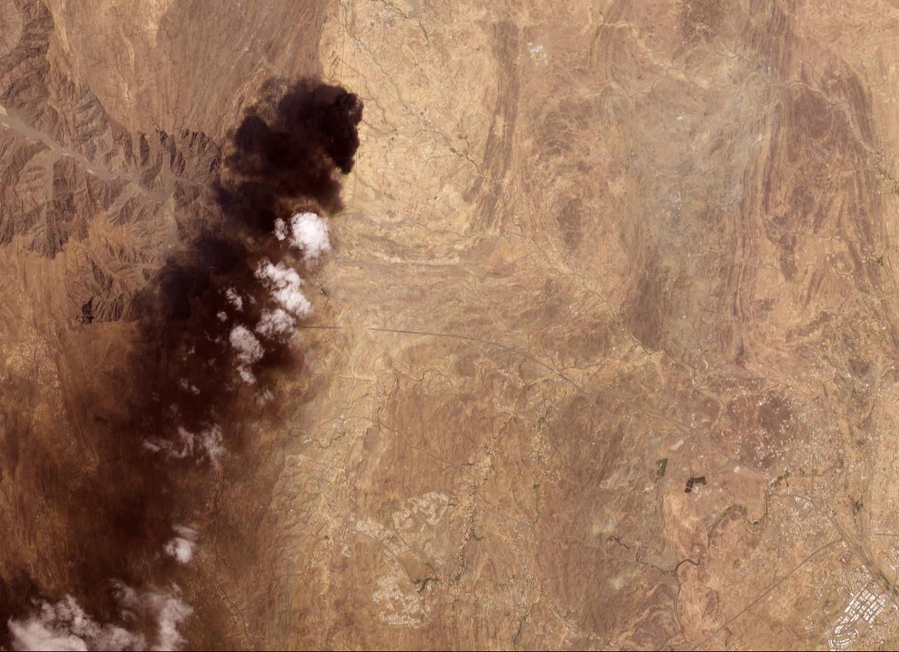 This handout satellite image taken by Planet Labs PBC on September 8, 2026, shows smoke billowing from an Aramco oil depot near the Saudi city of Abha following a Houthi attack. (AFP Photo/Handout/Planet Labs)
