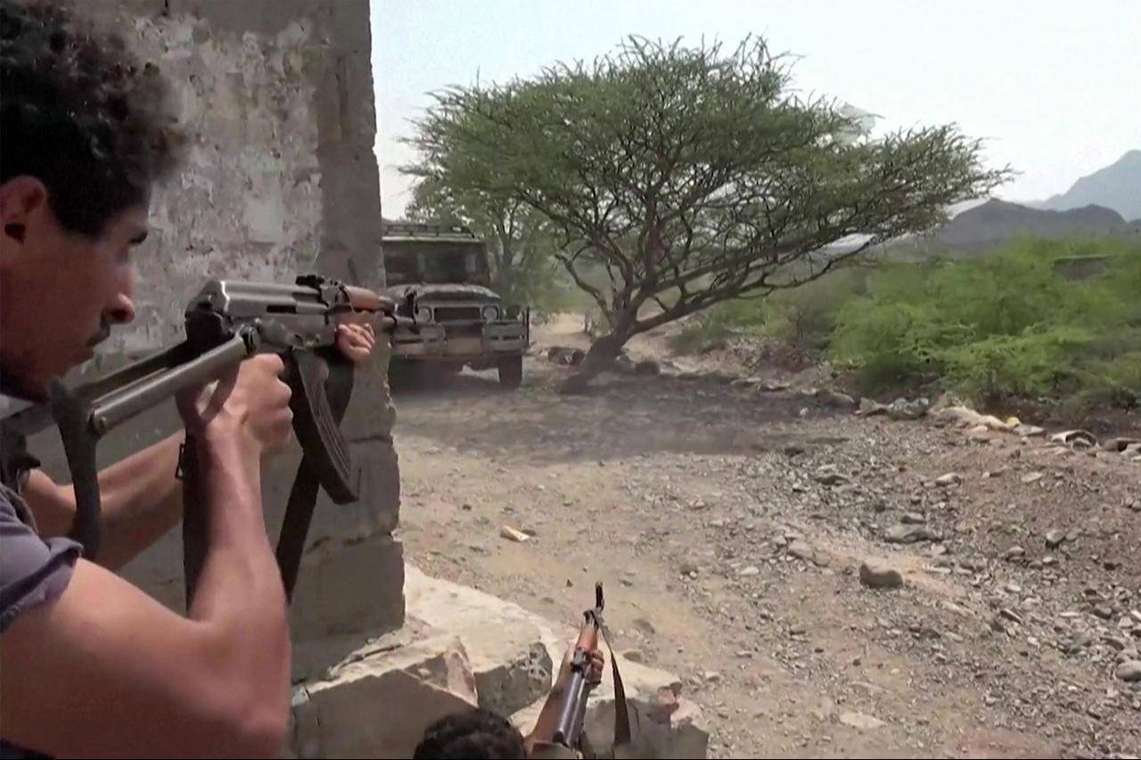 This screen grab, taken from video footage released on September 8, 2026, by the Saudi-backed National Resistance Forces in Yemen, shows fighters firing assault rifles from a position next to cover. (AFP Photo/Yemen National Resistance Forces/Handout)