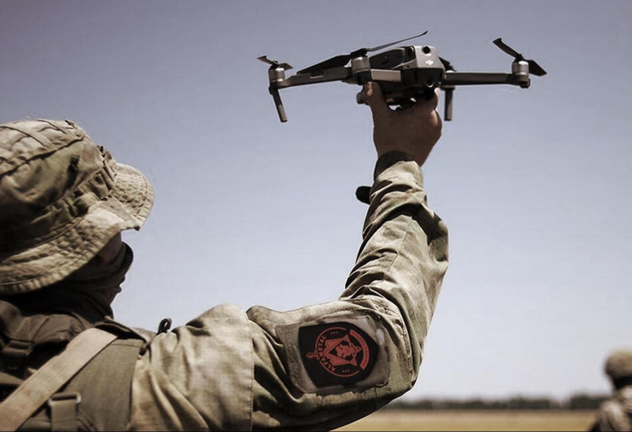 The photo shows an Alfa-Metal operator camouflaged, using a drone at an unspecified location and time. (Photo via alfa-metal.com)