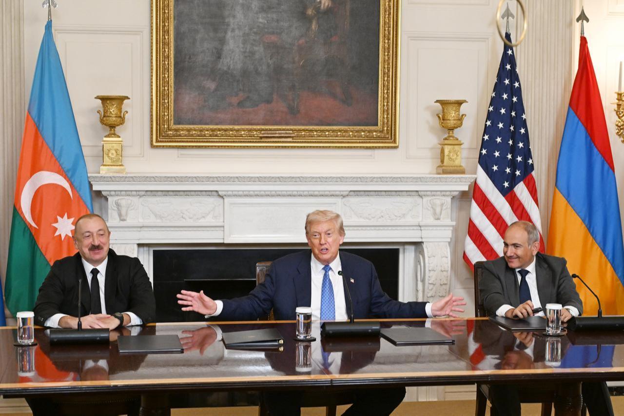 U.S. President Donald Trump (C), Azerbaijani President Ilham Aliyev (L), and Armenian Prime Minister Nikol Pashinyan (R) sign the joint declaration  peace roadmap  following their trilateral meeting at the White House in Washington D.C., United States on August 08, 2025. (Azerbaijan Presidency - AA Photo)