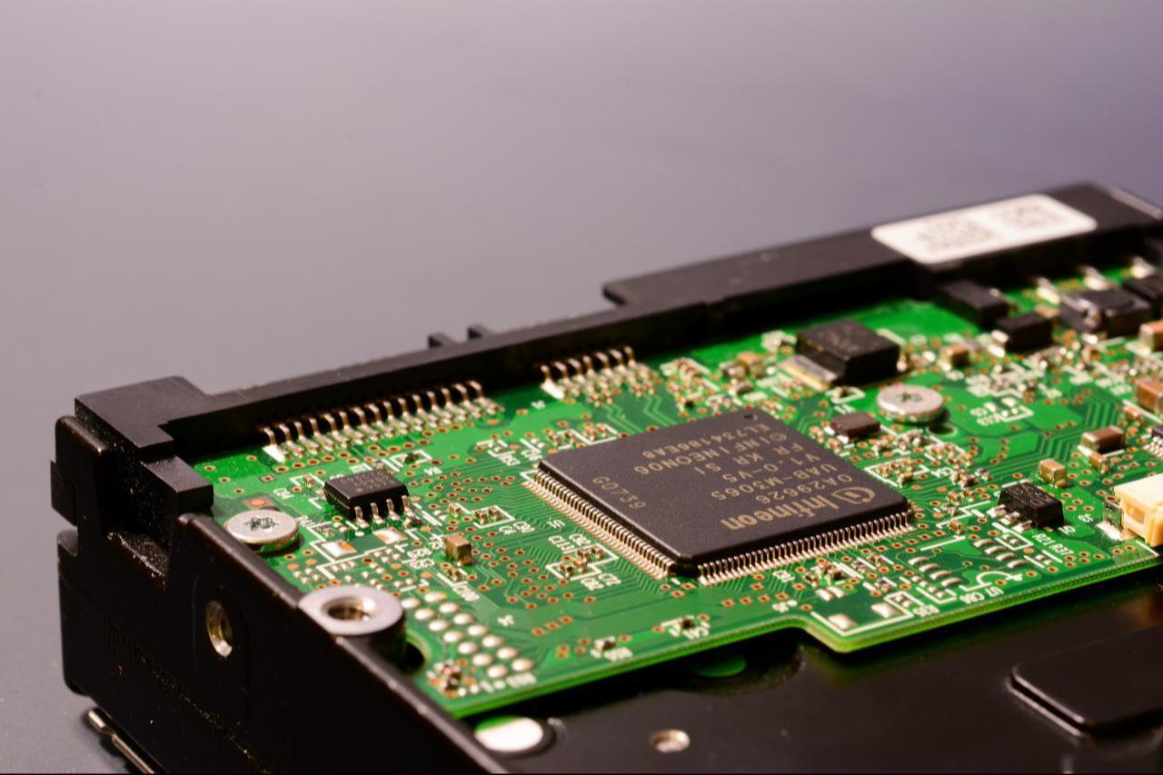 Close-up view of the internal circuitry of a hard disk with INFINEON chips, February 25, 2025. (Adobe Stock Photo)