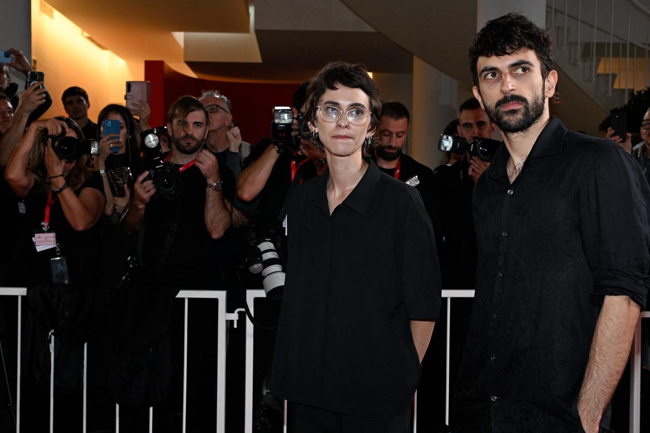 Israeli journalist and director Rachel Szor and Israeli journalist and filmmaker Yuval Abraham pose in front of photographers during the 83rd Venice International Film Festival in Venice, Italy, Sept. 10, 2026. (AFP Photo)