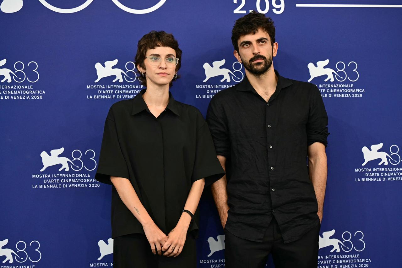 Israeli journalist and director Rachel Szor and Israeli journalist and filmmaker Yuval Abraham pose in front of photographers during the 83rd Venice International Film Festival in Venice, Italy, Sept. 10, 2026. (AFP Photo)