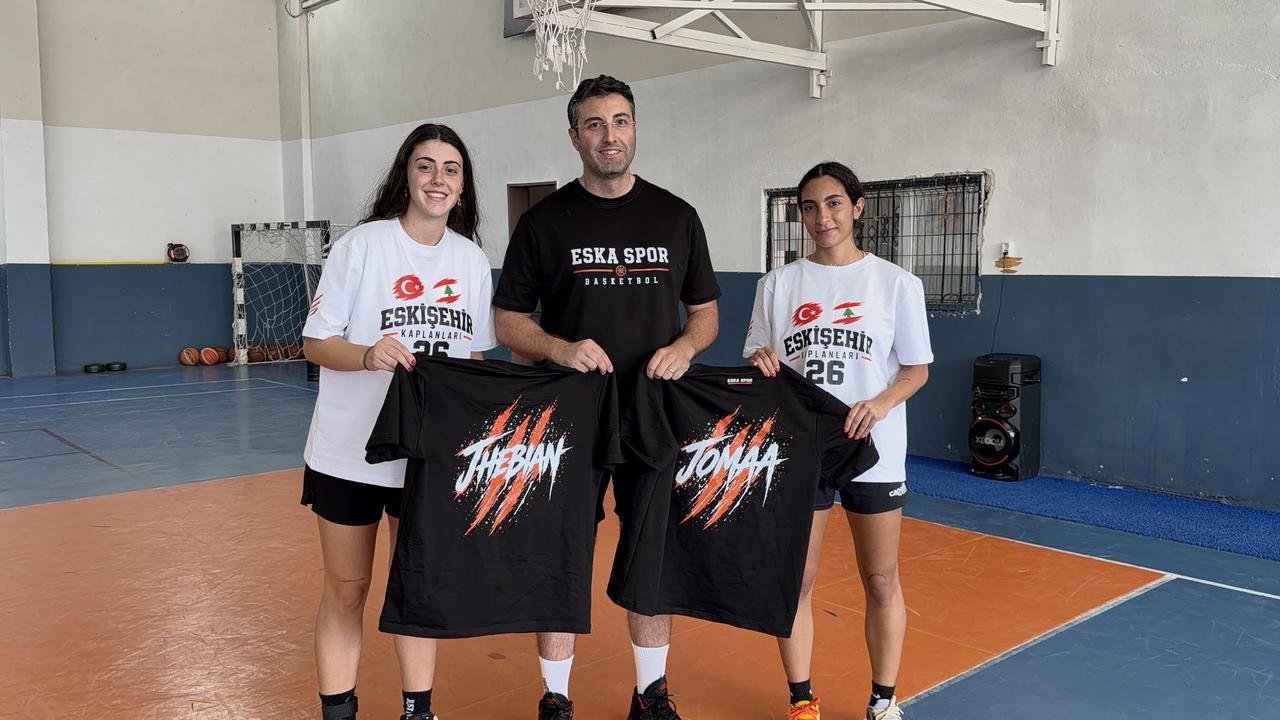 Two Lebanese women basketball players pose with their Turkish coach during a training program in Eskisehir, Türkiye. (AA Photo)