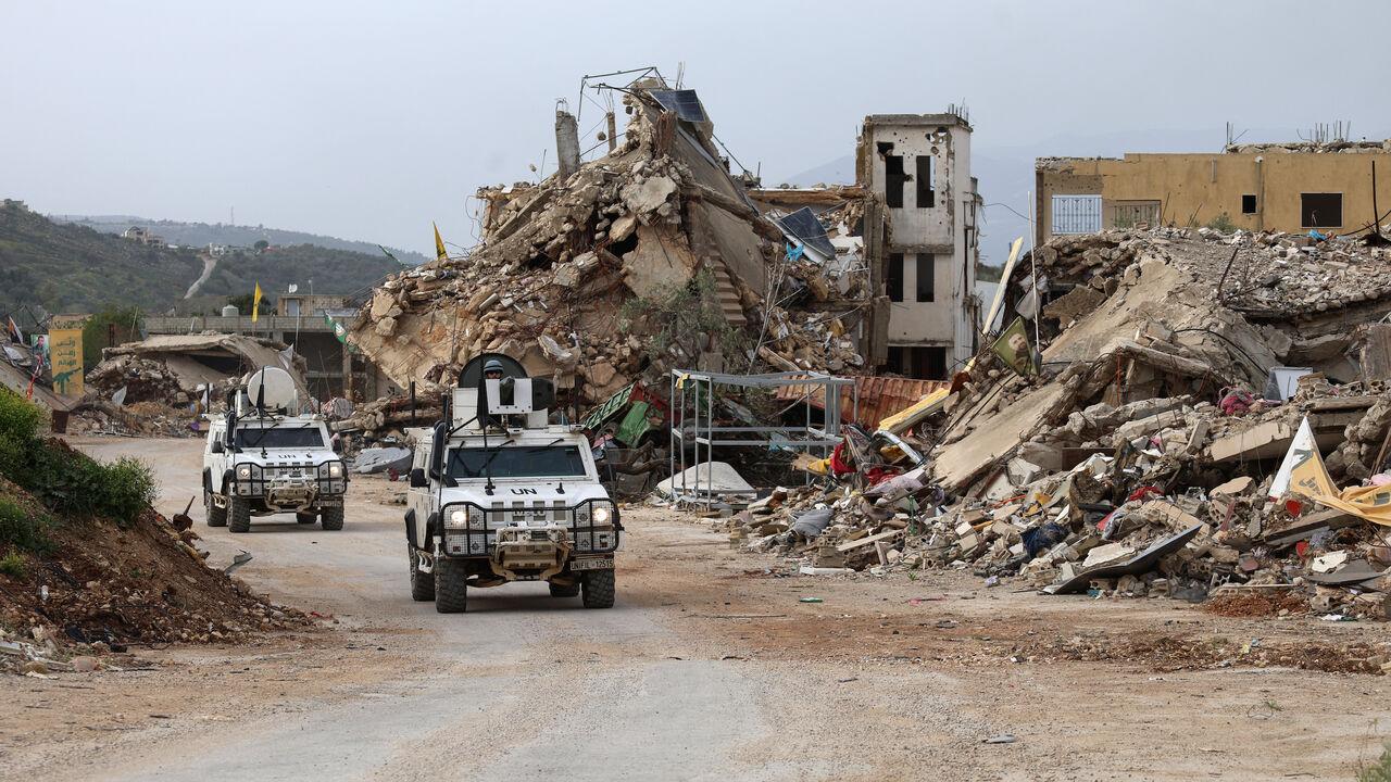 United Nations peacekeepers from the UN Interim Force in Lebanon (UNIFIL) drive past destroyed buildings while patrolling in Lebanon's southern village of Kfar Kila, April 6, 2025. (AFP Photo)