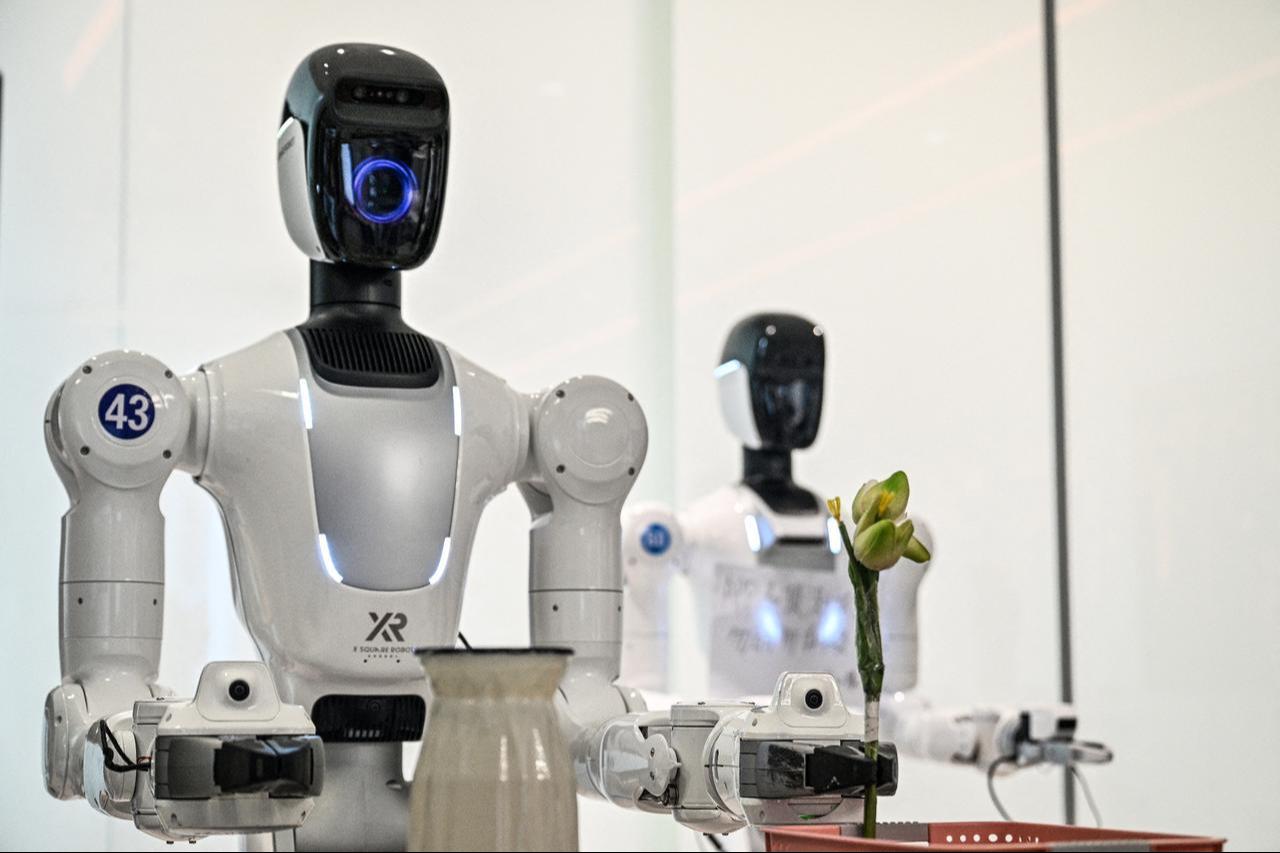 Humanoid robots are trained to do household tasks at the X Square Robot facilities in Shenzhen, southern China's Guangdong province on May 22, 2026. (AFP Photo)