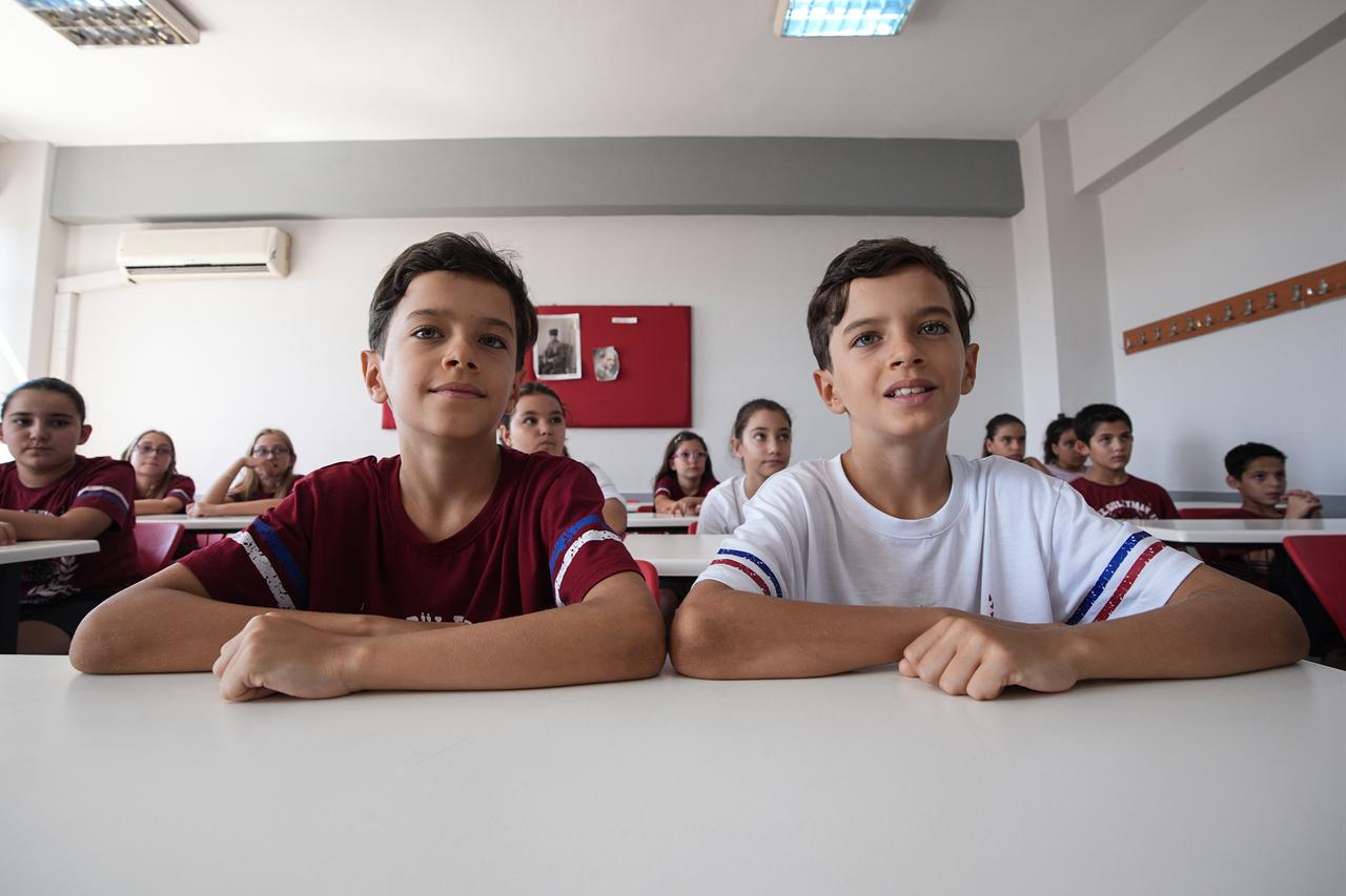 Twin brothers sit together in class at Makbule Suleyman Alkan Secondary School in Izmir, Türkiye on Sept. 13, 2026. (AA Photo)