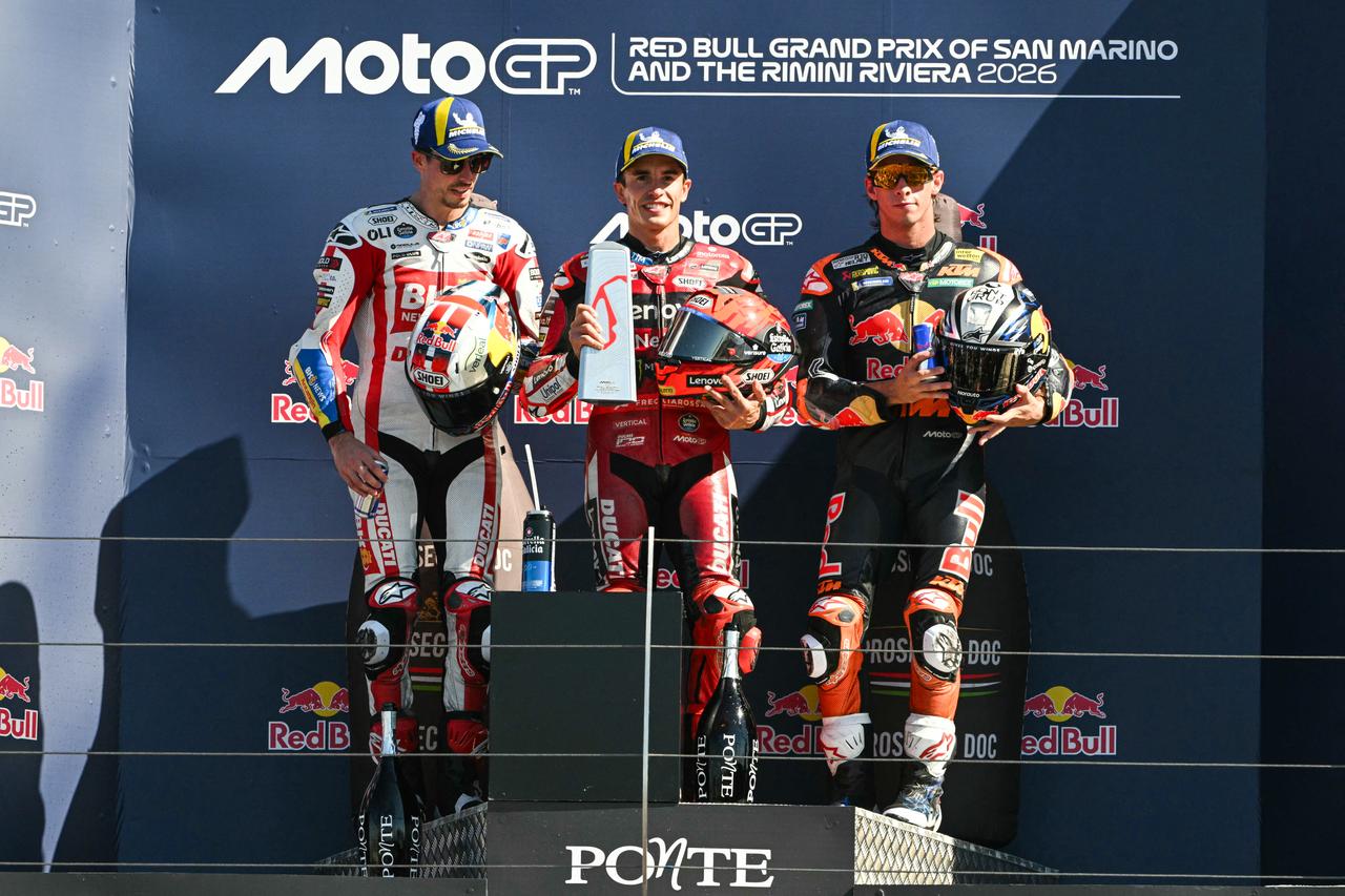 (FROM L) Second place BK8 Gresini Racing's Spanish rider Alex Marquez, first place Ducati Lenovo Team's Spanish rider Marc Marquez, and third place Red Bull KTM Factory Racing's Spanish rider Pedro Acosta celebrate on the podium (AFP Photo)
