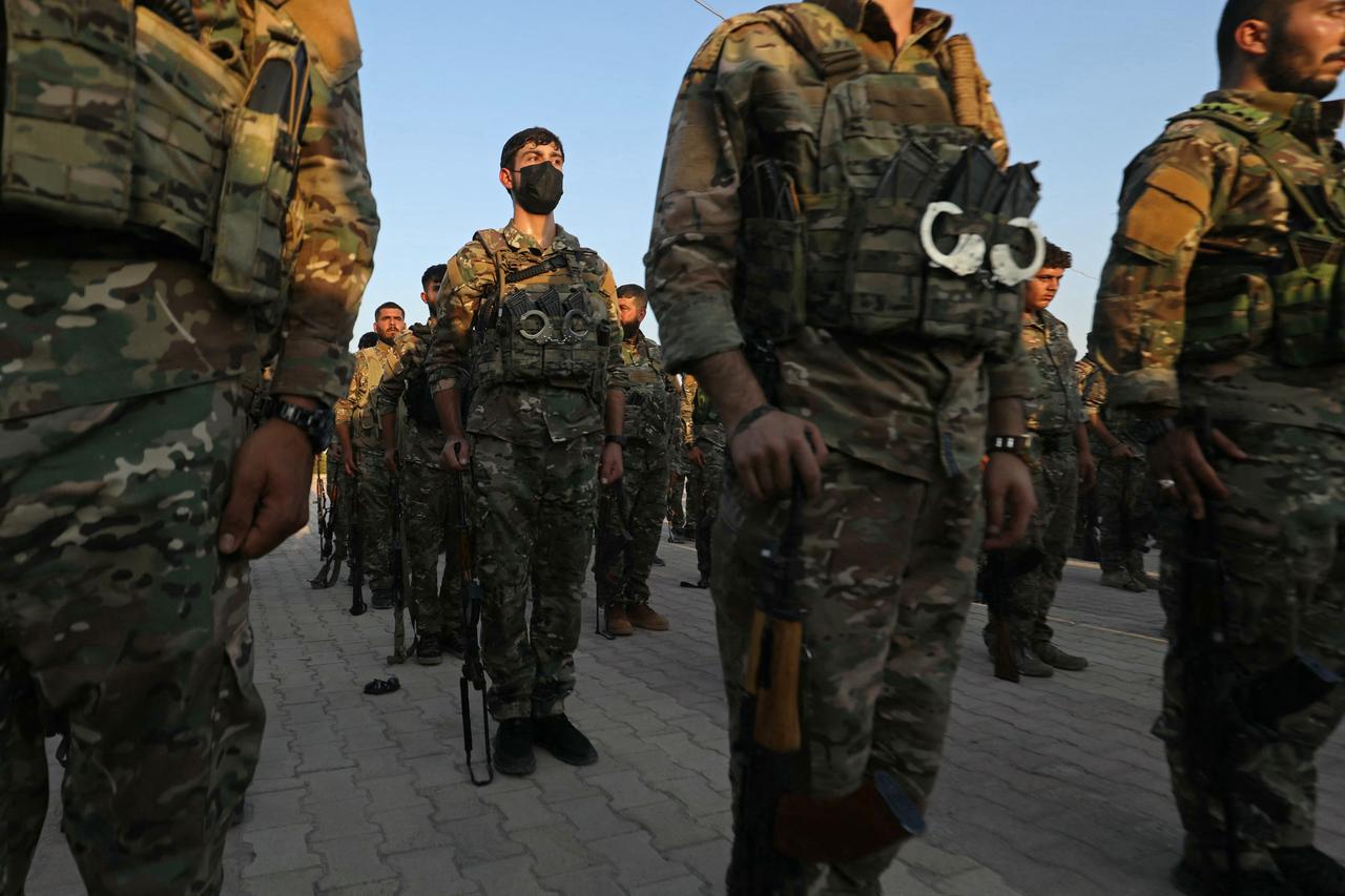 SDF members participate in a military parade in Qamishli on August 21, 2026. (AFP Photo)
