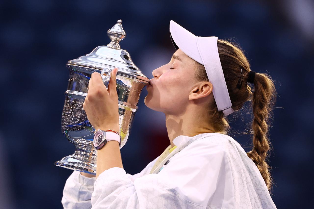 Rybakina kisses the winner's trophy after winning the women's singles final tennis match against Sabalenka on Sept. 12, 2026. (AFP Photo)