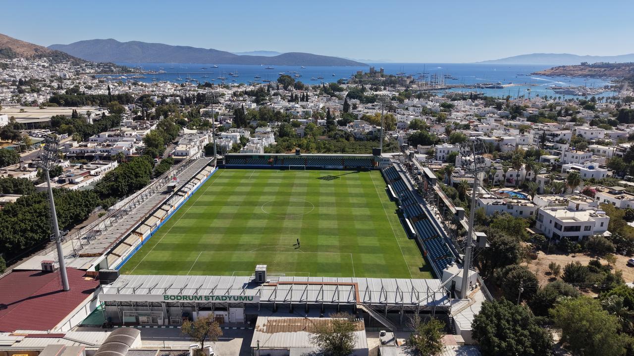 Bodrum FK supporter Birol Ahi poses at Bodrum Stadium after receiving a lifetime season ticket from the club, in Bodrum, Mugla, Türkiye, Sept. 13, 2026. (AA Photo)