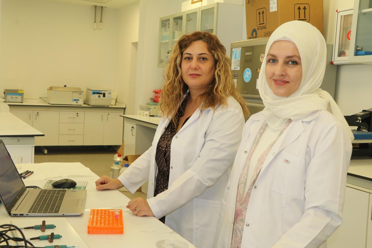 Researchers pose in a laboratory at Cankiri Karatekin University with the biosensor test system they developed for the early detection of ovarian cancer, in Türkiye on Sept. 13, 2026. (AA Photo)