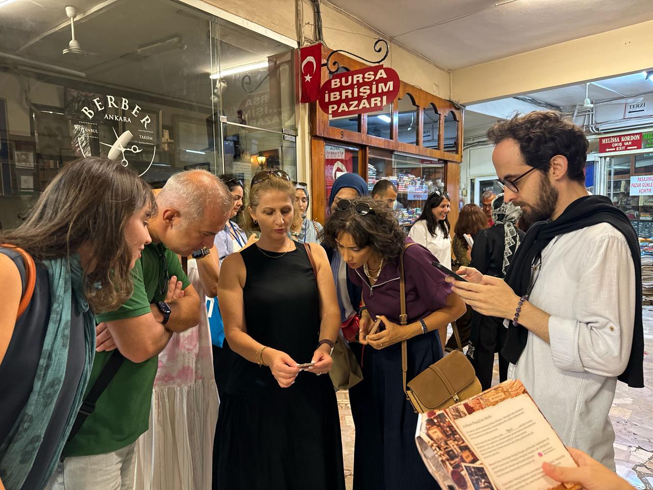 Participants examine materials and follow clues during the “Beyoglu’s Hidden Stories” heritage discovery route as part of European Heritage Days 2026 in Istanbul, Türkiye. (AA Photo)