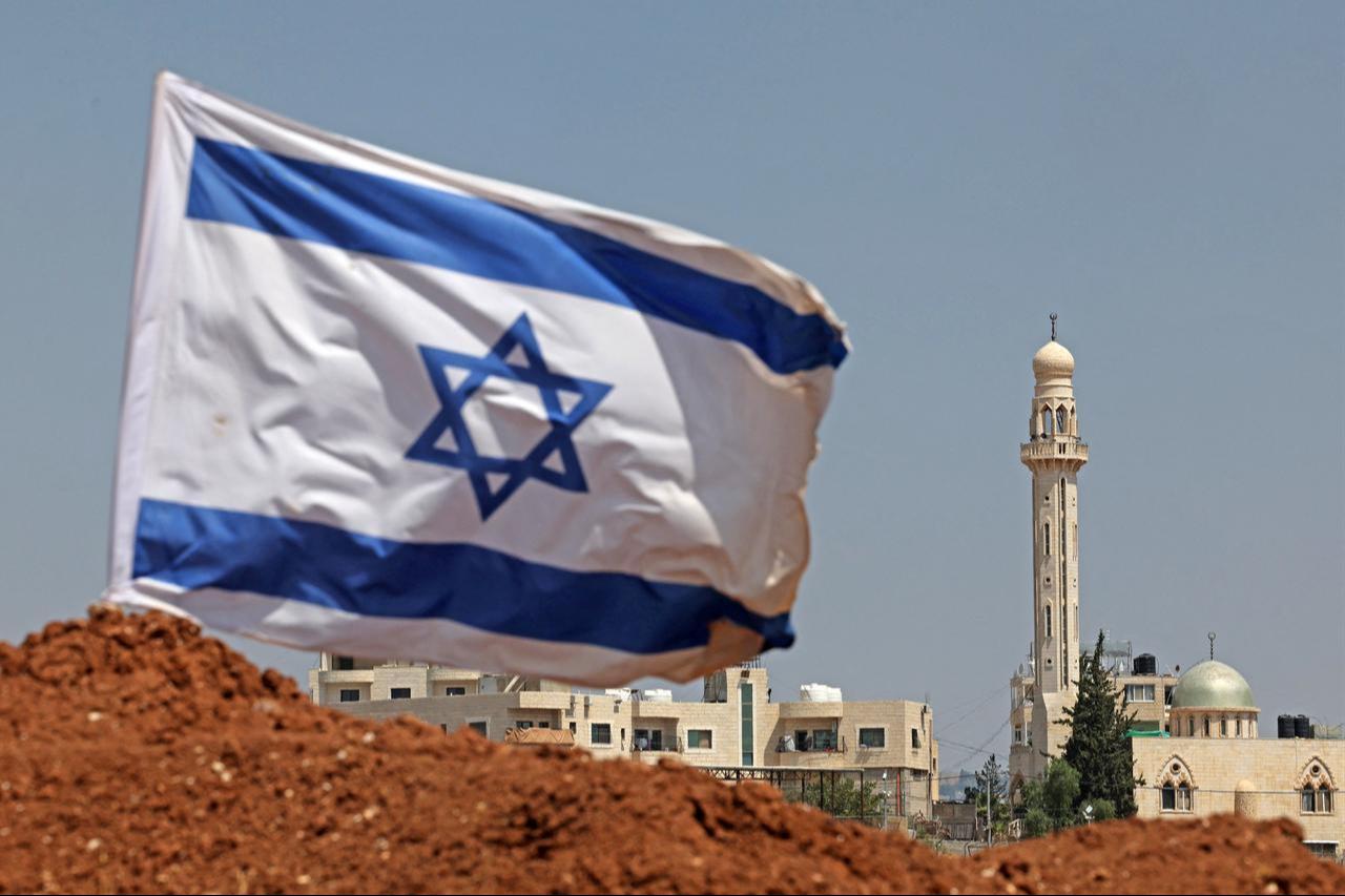 An Israeli flag installed by illegal settlers is pictured in Beit Sahur, south of Bethlehem, in the occupied West Bank on August 14, 2026. (AFP Photo)