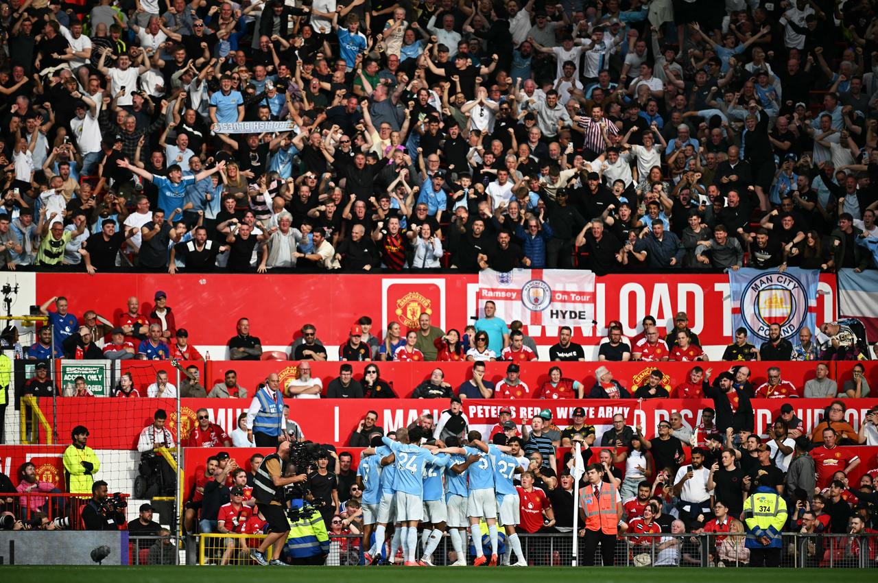 Manchester City's Norwegian striker #09 Erling Haaland celebrates scoring the team's first goal with teammates during the English Premier League football match between Manchester United and Manchester City at Old Trafford in Manchester, north west England, on September 13, 2026. (AFP Photo)