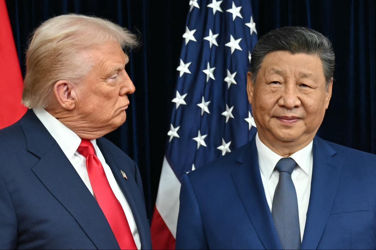 US President Donald Trump (L) and China's President Xi Jinping arrive for talks at the Gimhae Air Base, located next to the Gimhae International Airport in Busan, Oct. 30, 2025. (AFP Photo)