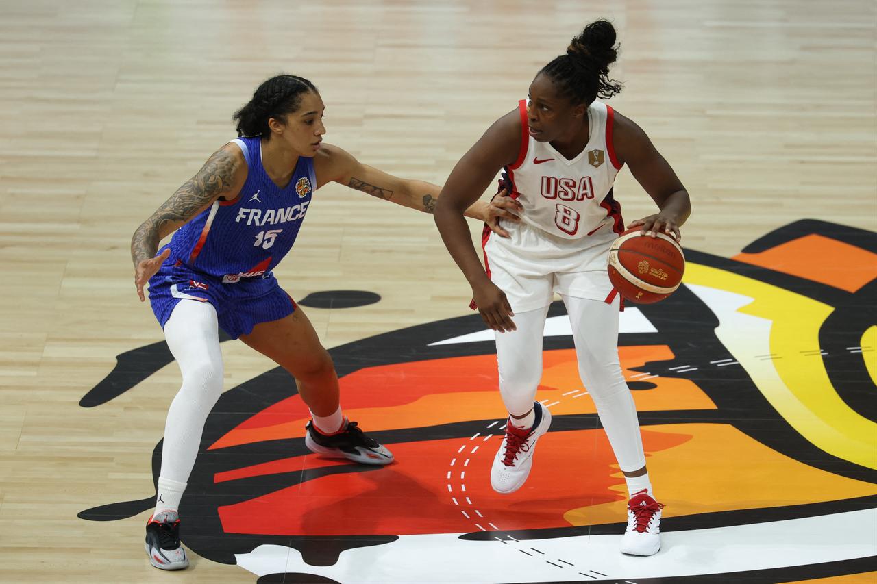 France's forward #15 Gabby Williams and USA's guard #08 Chelsea Gray vie for the ball during the 2026 FIBA Women’s Basketball World Cup final game between the United States and France in Berlin on September 13, 2026. (AFP Photo)