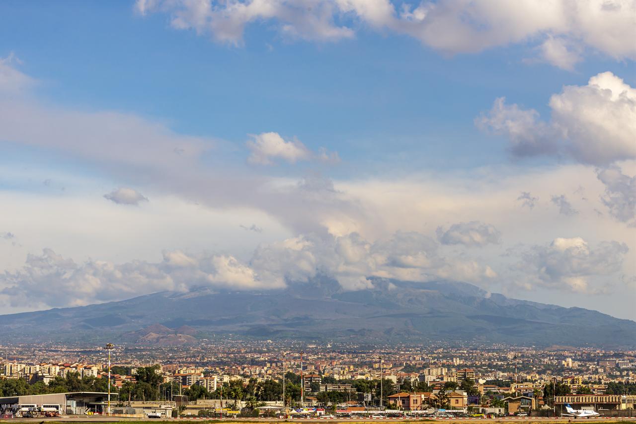 Mount Etna and its ash cloud loom over Catania and Catania-Fontanarossa Airport in Sicily, Italy, Sept. 15, 2026. (AA Photo)
