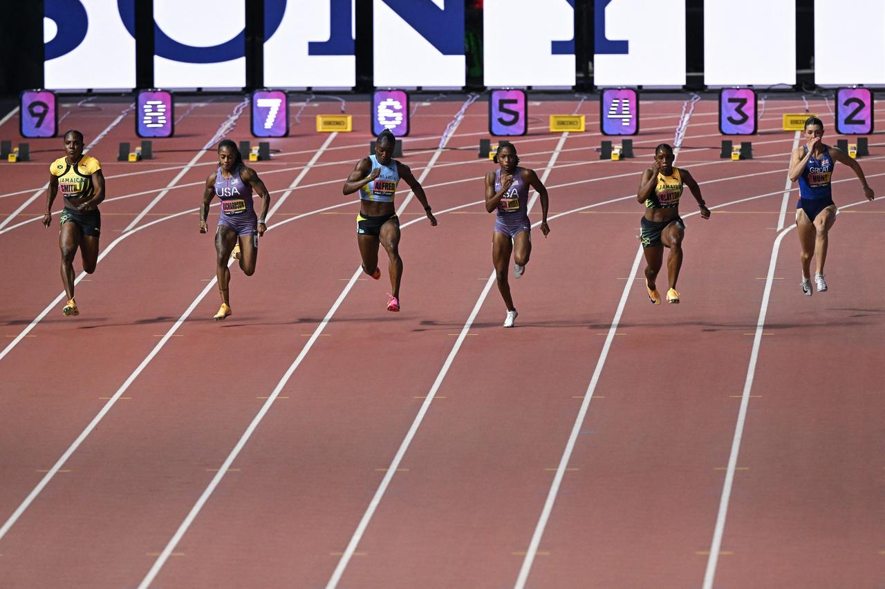 U.S. sprinter Melissa Jefferson-Wooden races ahead of Julien Alfred of Saint Lucia, Sha'Carri Richardson of the U.S., Jonielle Smith and Tina Clayton of Jamaica, and Amy Hunt of Britain in the women's 100-meter final at the World Athletics Ultimate Championship in Budapest, Hungary, Sept. 12, 2026. (AFP Photo)