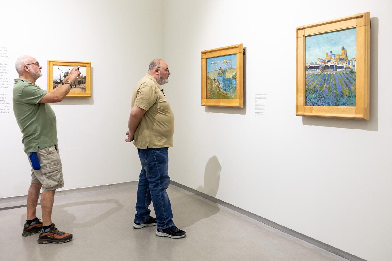 Visitors view paintings by Vincent van Gogh during the “Van Gogh, All Our Paintings” exhibition at the Kröller-Müller Museum in Otterlo, Netherlands, Sept. 15, 2026. The exhibition brings together all 88 Van Gogh paintings in the museum’s collection for the first time since 1984. (AFP Photo)