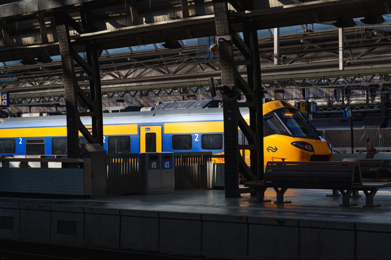 A passenger train waits at a platform at a historic railway station in Amsterdam, Netherlands, Aug. 12, 2026. (Adobe Stock Photo)