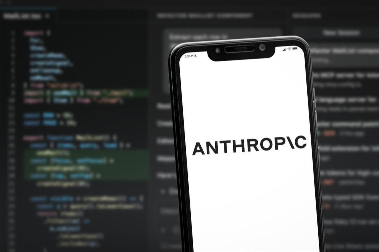 The photo shows a smartphone displaying Anthropic AI branding with a programming interface background in Cali, Colombia, on May 27, 2026. (Adobe Stock Photo)