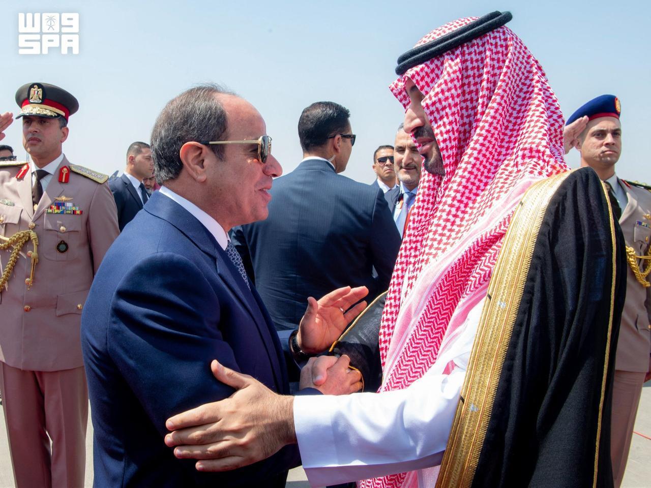 Egyptian President Abdel Fattah al-Sisi (L) shaking hands with Saudi Crown Prince Mohammed bin Salman during a welcoming ceremony at Cairo's International airport on Sept. 15, 2026. (AFP Photo/Handout/SPA/Ahmed Nureldine)