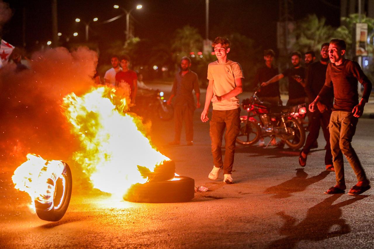 Demonstrators block a road with flaming tires while protesting hikes to fuel prices in al-Bab, northeast of Aleppo in northern Syria, on September 14, 2026. (AFP photo)