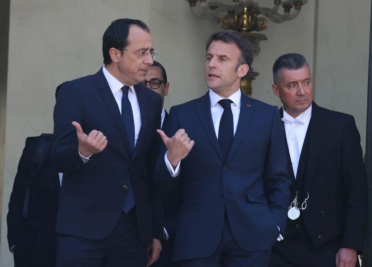 French President Emmanuel Macron (center) welcomes Cypriot President Nikos Christodoulides (left) at the Elysee Palace in Paris on Wednesday, May 03, 2023. (Photo via Greek Cypriot authorities)