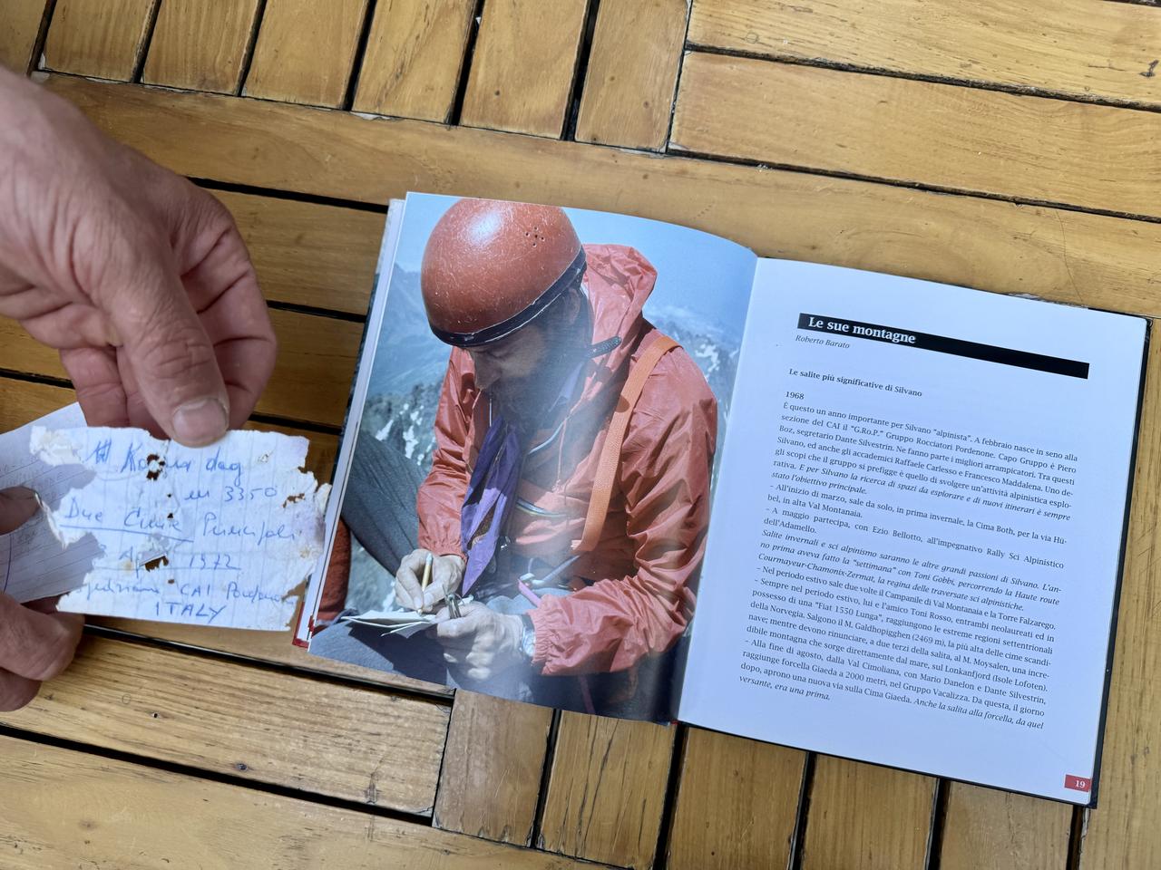 A handwritten note by Italian mountaineer Silvano Zucchiatti is displayed alongside a book documenting his expedition in the Kackar Mountains, in Trabzon, Türkiye, Sept. 15, 2026. (AA Photo)