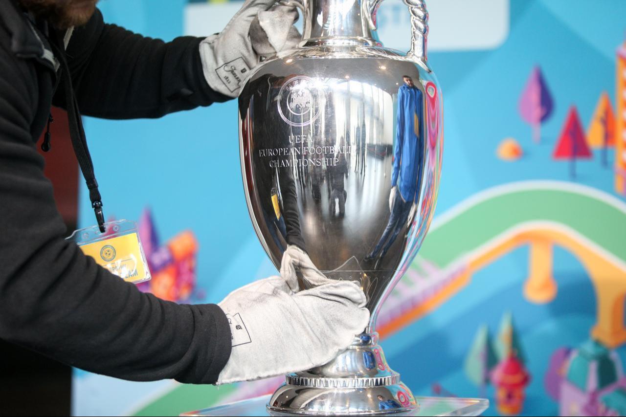A staff member handles the Henri Delaunay Trophy, awarded to winners of the UEFA European Championship. (Adobe Stock Photo)