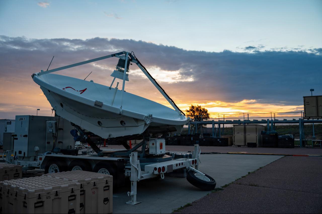 The sun rises over Electromagnetic Warfare systems while U.S. Space Force Guardians demonstrate their combat readiness at Peterson Space Force Base, Colo., August 12, 2026. (Photo via U.S. Space Force )