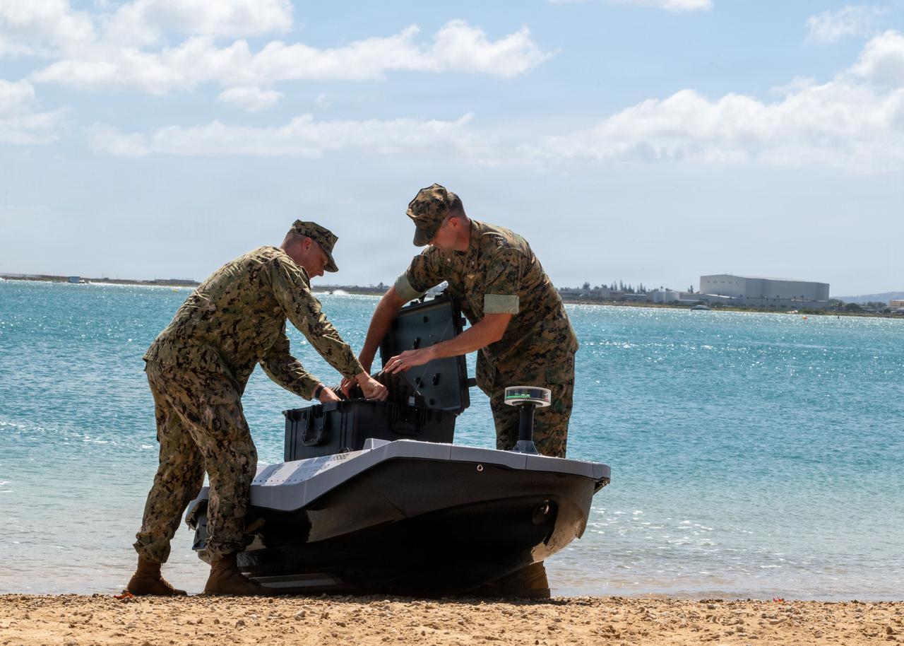 U.S. Marine Corps load cargo onto a digitally crewed surface vessel at the Honolulu Harbor Public Boat Ramp during Exercise Rim of the Pacific 2026 in Honolulu, Hawaii, July 7, 2026. (Photo via U.S. Navy)