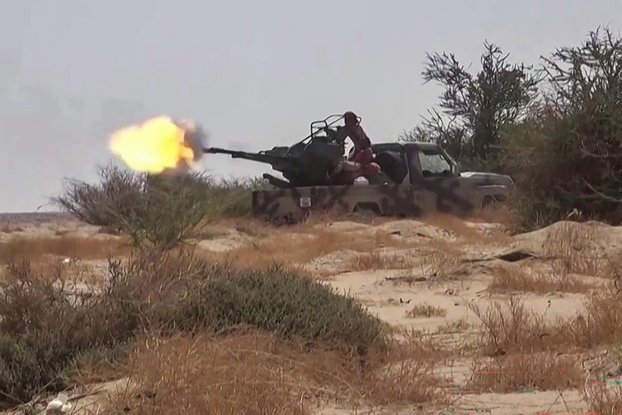 This frame grab taken from AFPTV video footage shows fighters affiliated with the Saudi-backed Yemeni government engaging in clashes with Houthi authorities in Al-Jawf province on September 15, 2026. (AFP Photo)