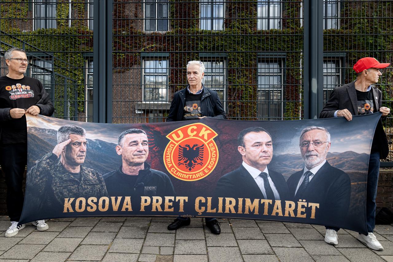 Thaci's supporters hold a banner as they wait outside the Kosovo Specialist Chambers (KSC) for the verdict in the trial against former Kosovar President Hashim Thaci and three former leaders of the Kosovo Liberation Army in The Hague on September 16, 2026. (AFP Photo)