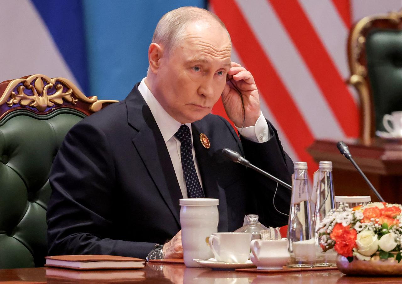 In this pool photograph distributed by the Russian state agency Sputnik, Russia's President Vladimir Putin attends the 18th BRICS Summit in New Delhi on September 12, 2026. (Photo by Sputnik / AFP)