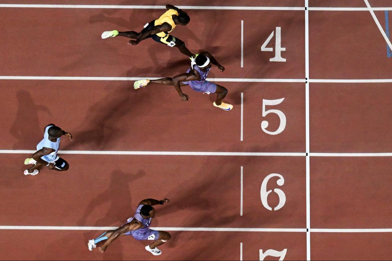 U.S. sprinter Kenny Bednarek crosses the finish line ahead of Jamaica's Oblique Seville, Botswana's Letsile Tebogo and U.S. sprinter Christian Coleman in the men's 100-meter final at the World Athletics Ultimate Championship in Budapest, Hungary, Sept. 12, 2026. (AFP Photo)