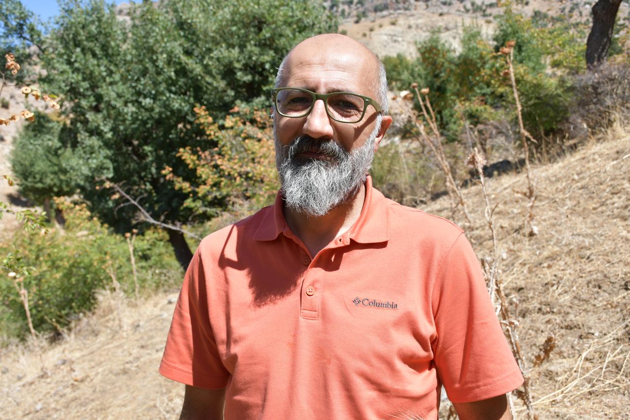 Resit Ugran, a researcher involved in documenting the newly identified Sason tulip stands in the countryside of Sason, Batman, Türkiye, Sept. 16, 2026. (AA Photo)