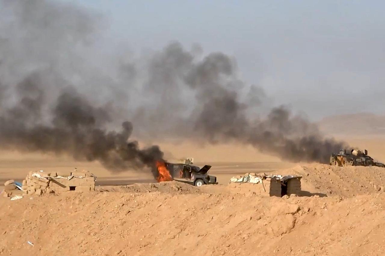 This handout picture released on September 15, 2026 by Ansarullah Media Centre reportedly shows burning military vehicles that they targeted in al-Jawf. (Photo by Ansarullah Media Centre / AFP)