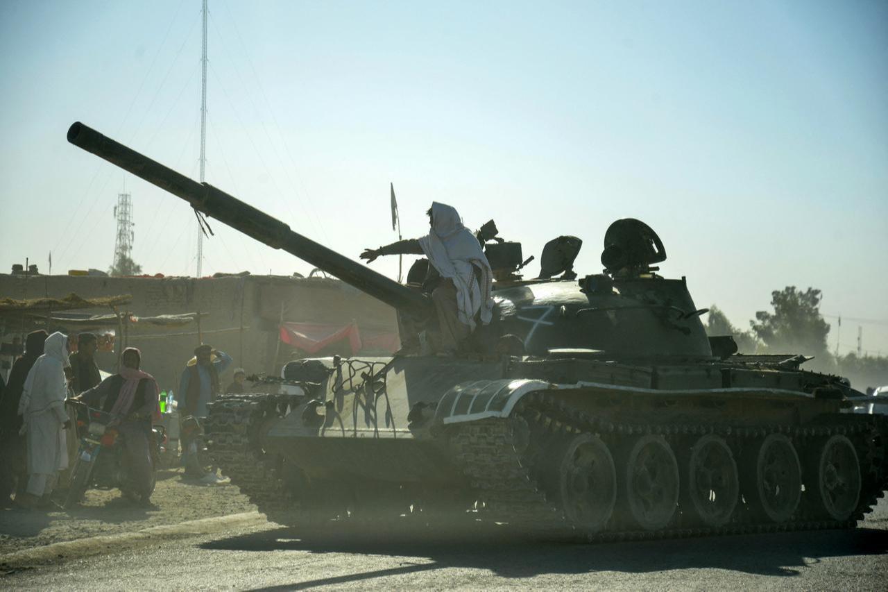 Taliban security personnel on a Soviet-era tank ride towards border, during ongoing clashes between Taliban and Pakistani, in Spin Boldak district of Kandahar Province, Oct. 15, 2025. (AFP Photo)