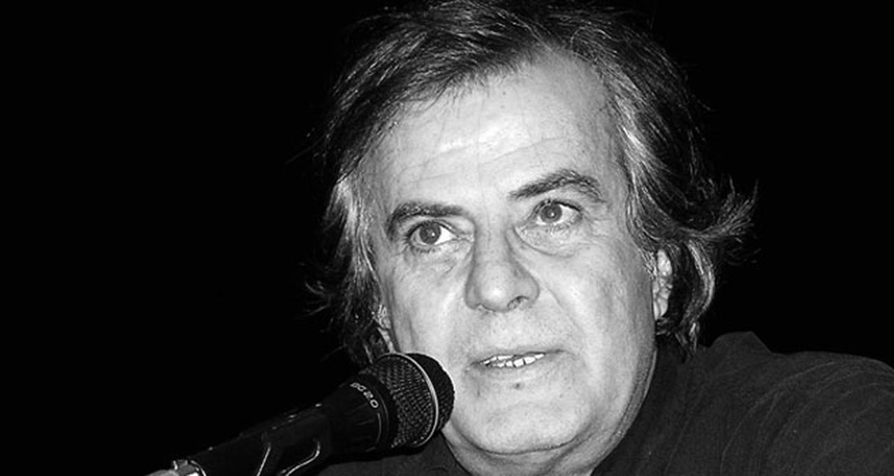 Tarık Akan speaks into a microphone. (Photo via AA)