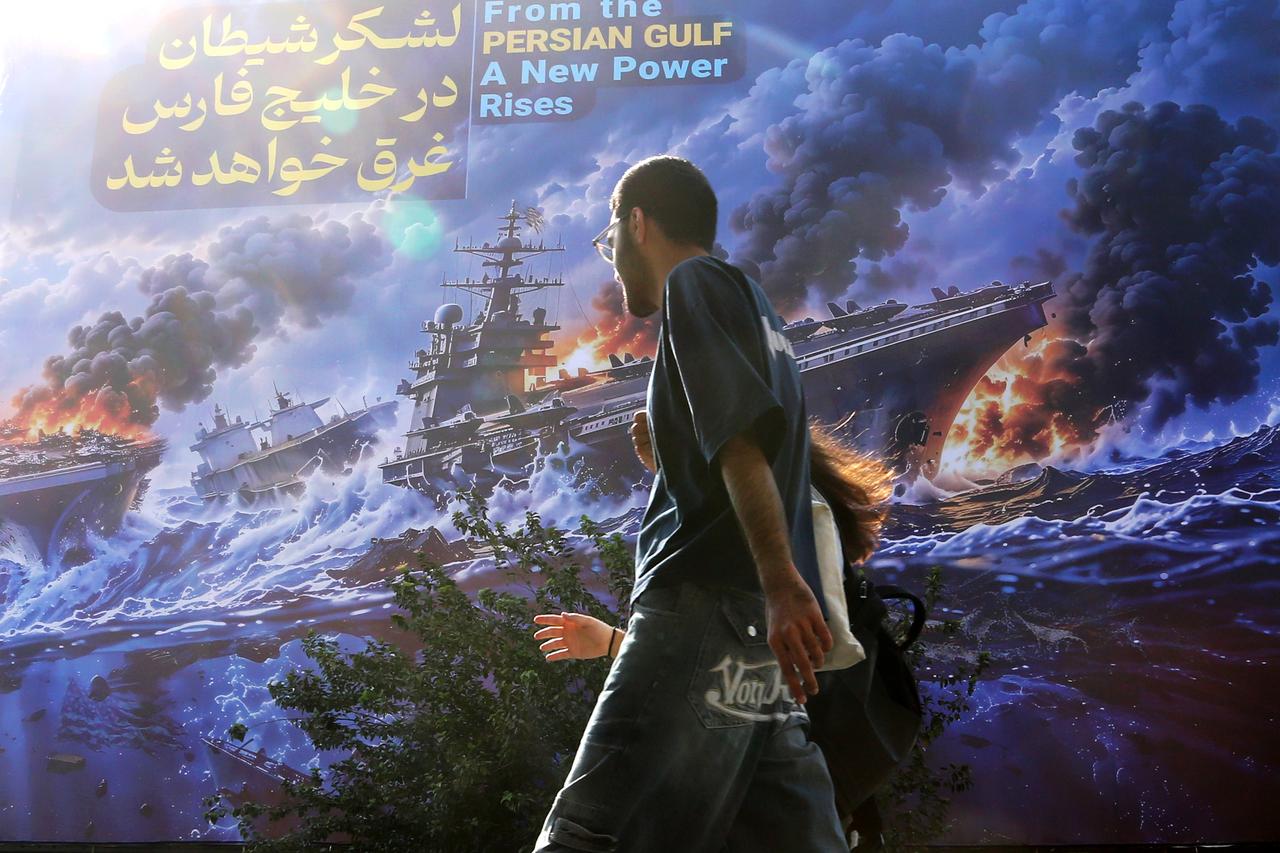 A huge anti-American billboard reading in Persian "The army of Satan will drown in the Persian Gulf" is unveiled at Enqelab Square amid heightened tensions between Iran and the United States as daily life continues in Tehran, Iran, on September 13, 2026. (AA Photo)