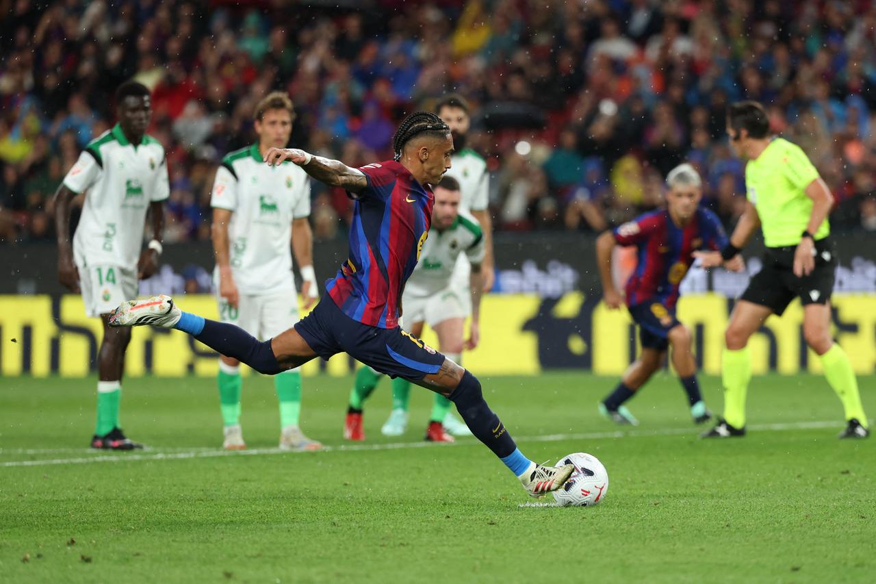 Barcelona's Brazilian forward #11 Raphinha converts a penalty to score his team's second goal during the Spanish league football match between FC Barcelona and Racing Santander at the Camp Nou stadium in Barcelona on September 16, 2026. (AFP Photo)