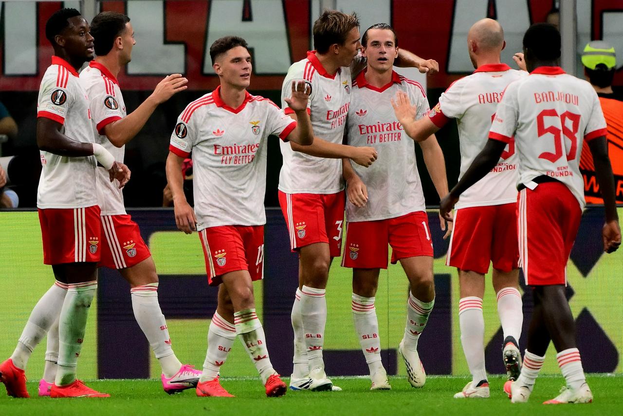 Benfica’s Polish forward #13 Jakub Kaminski celebrates with teammates after scoring his team's second goal during the UEFA Europa League 1st round day 1 football match between Ac Milan and Benfica at the San Siro Stadium in Milan on September 16, 2026. (AFP Photo)