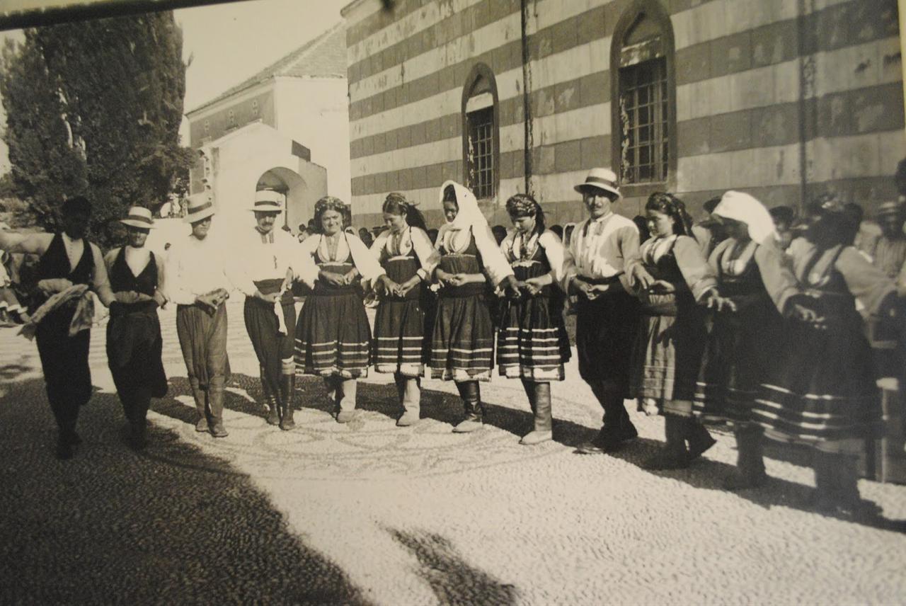Italians and Rums join hands in a traditional dance during a harvest festival organized by the Fascist administration on Rhodes, circa 1930. (Photo via Ottoman History Podcast)