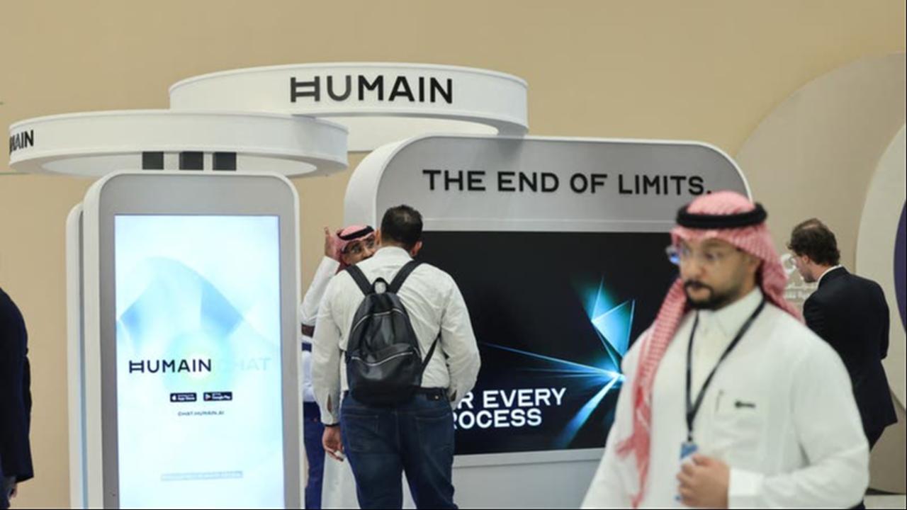 Guests stand at the booth of Saudi artificial intelligence company Humain during the Future Investment Initiative (FII) conference in Riyadh, Saudi Arabia, Oct. 29, 2025. (AFP Photo)