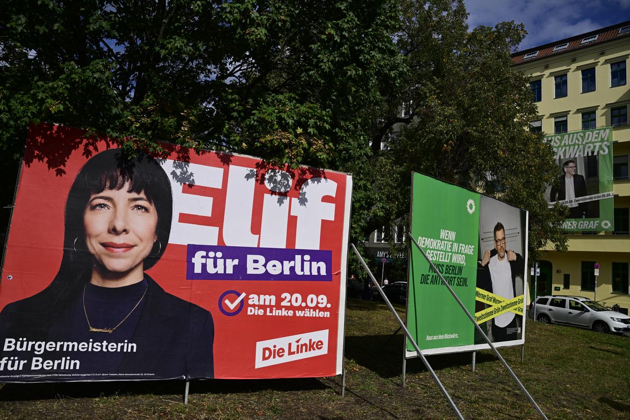 Election campaign posters depicting top candidate of the left-wing Die Linke (The Left) party Elif Eralp (L) and top co-candidate of the Greens Werner Graf for the upcoming Berlin state elections are pictured in Berlin on September 15, 2026. (AFP Photo)